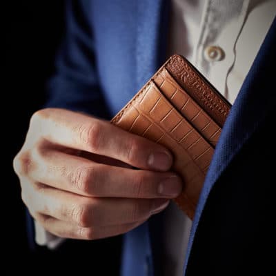 brown car holder white shirt wallet